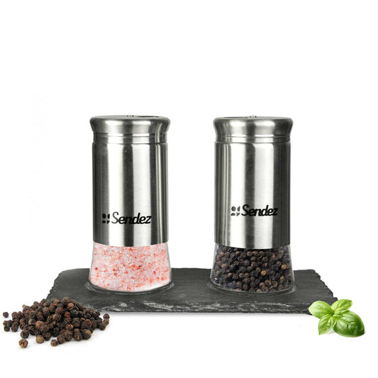 Salt and pepper shakers on a sheer plate, spice shakers, salt shakers