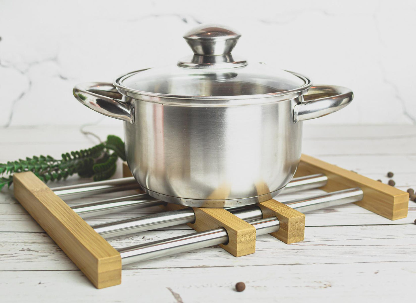 Extendable coaster for pots, pans and casserole dish pot rack grid